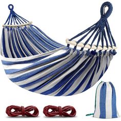 a blue and white striped hammock with two drawsacks next to it