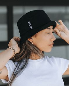 Introducing the Sand Cloud Bucket Hat, a must-have for your sunny adventures. This hat features a beautifully embroidered white Sand Cloud logo and a stylish 2-inch flap, perfect for adding both flair and sun protection to your look. Made from 100% cotton; fits most. Approx size : 56cm Women's Fit Color : Black Bucket Hat Unisex with Flat Sand Cloud Round Icon Embroidery in White 100% Cotton Made in China Care Details: Machine Wash Cold Delicate Cycle Do Not Bleach Hang Air Dry Do Not Iron Do No Trendy Cotton Sun Hat With Flat Brim, Adjustable Cotton Bucket Hat With Uv Protection, Adjustable Cotton Sun Cap, Wide Brim Hat With Embroidered Logo For Outdoor, Black Cotton Summer Sun Hat, Spring Cotton Sun Hat For Streetwear, Summer Cotton Bucket Hat With Adjustable Fit, Adjustable Cotton Hats With Uv Protection, Adjustable Summer Cotton Bucket Hat