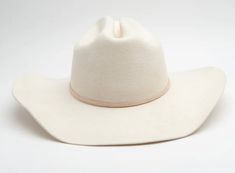 This hat is so beautiful and so elegant. The cream color is so pretty and would match with basically anything! This is more of a cowboy hat shaped hat.. rather than the flat/sun hats we have. Come with leather band (we can customize). One size fits all, adjustable band, 100% Wool. White Short Brim Hat For Ranch, White Short Brim Ranch Hat, White Fedora With Curved Brim For Rodeo, White Flat Brim Hat For Ranch, White Country Style Hat With Flat Brim, White Western Felt Hat For Kentucky Derby, White Brimmed Country Top Hat, White Western Hat With Short Brim, White Brimmed Country Style Top Hat