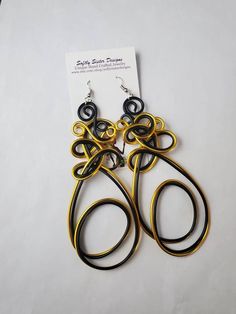 Beautiful black and gold colored aluminum wire wrapped  earrings are a totally unique design and are 4 inches long with hypoallergenic surgical steel earwires. Please come back and visit to check for new unique designs.  For more styles visit my Etsy shop: www.etsy.com/shop/SoftlySisterDesigns Afrocentric Earrings, Wrapped Earrings, Earrings Wire, Wire Wrapped Earrings, Earrings Long, Wire Earrings, Wire Art, Earrings Dangle, Long Earrings