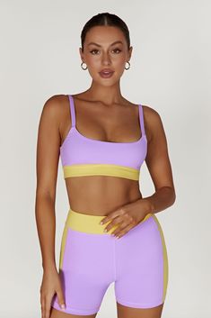 Race you to the top. Our BECCA Two Tone Cropped Sports Bra is designed with a cropped length, fully-lined, bodycon fit, wide straps and the option to remove the bust cups, making it a perfect choice for high impact sports or simply supportive for lounging. We’ve also incorporated our silicone MESHKI logo detailing throughout and our ultra soft FLEXI Butter fabrication for a supportive fit. Everyone at HQ is pairing this with our Alexandra Oversized Button Up Shirt and Taleah Two Tone Shorts to c Yellow Crop Top With Built-in Bra, Yellow Stretch Sports Bra, Yellow Stretch Sports Bra Athleisure, Yellow Stretch Sleeveless Sports Bra, Yellow Fitted Tank Top For Sports, Yellow Sleeveless Stretch Sports Bra, Yellow Sports Tank Top, Yellow Stretch Seamless Sports Bra, Yellow Seamless Stretch Sports Bra