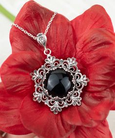 "This beautifully handcrafted filigree art daisy flower pendant feature with Black Onyx gemstone. Exquisitely crafted, handmade daisy flower pendant necklace would be your perfect option for anniversary, birthday, thanksgiving or Christmas gift for yourself or loved one.  For gold plated option, visit that link; https://www.etsy.com/FiligranUSA/listing/1401924202 The optional silver chain length is 18.00\" (45.7 cm)  + 2.00\" (5.10 cm) extension.  The Black Onyx gemstone diameter is 16 mm, cabochon round-cut.  This metal embroidery filigree pendant is oxidized and highly polished. Comes with a velvet pouch, silver polish cloth and a luxurious gift box. What is Filigree Art? Filigree is made of delicate metal strands that have been skillfully fashioned to create an outstanding combination o Black Filigree Pendant Jewelry, Black Flower Charm Pendant Jewelry, Black Flower Charm Jewelry, Black Jewelry With Flower Charm Pendant, Black Jewelry With Flower Charm As Gift, Black Flower Jewelry For Gift, Black Intricate Design Jewelry As Gift, Elegant Black Flower Pendant Jewelry, Onyx Cabochon Jewelry Gift