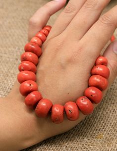 Here is an authentic Tibetan Red Coral bead mala or neckpiece. Deep red colour with natural aged Tibetan coral, ideal for investment and highly collectable. It is a rare piece and not many come around. Tibetans believe these corals and precious beads hold immense power in terms of the owner's physical health & spiritual wellness. We constantly hear the depth of the colours and radiances reflect one's current physical stats. Wearing such jewellery close to your skin absorbs your own physical cond Red Polished Beads Necklace For Meditation, Vintage Red Gemstone Beads, Vintage Red Wooden Beads, Traditional Red Coral Hand-strung Beads, Traditional Hand-strung Red Coral Beads, Red Wooden Beads Round Necklace, Traditional Red Gemstone Beads Bracelet, Traditional Red Coral Beads, Red Necklace With Wooden Beads