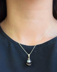 The size of the Tahitian black pearl is approximately 9.6mm and is set in 14K yellow gold. The pearl is greenish black in color with high luster. The height of the pendant from the top of the bail to the bottom of the pendant is approximately 7/8 inches long. The 14K yellow gold chain is approximately 16 inches long. All inventory is in stock and ready to be shipped as soon as I have received payment. For more information, Like us on Facebook, follow us on Instagram or visit our website www.iked Black Tahitian Pearl Fine Jewelry, Black Tahitian Pearl Necklace With Pendant, Black Tahitian Pearl Pendant Necklaces, Black Tahitian Pearl Pendant Necklace, Pearl Pendant Set, Black Pearl Pendant, Tahitian Black Pearls, Yellow Gold Chain, The Pearl