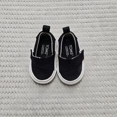 Give Your Little One A Stylish And Comfortable Footwear Option With These Black Toms Slip-On Sneakers. Perfect For Both Baby Boys And Girls, They Feature A Fabric Upper Material And A Slip-On Closure For Easy On And Off. The Sneakers Are Branded With The Iconic Toms Logo And Come In Size 4 For Toddlers. Excellent Used Condition ~ Super-Fast Shipping, Ships The Same Or Next Business Day! ~All Items Shipped In Polymailers. ~ All Items Come From A Smoke Free Home. ~ Willing To Offer Bundle Discounts And Combined Shipping. ~ All Clothing Items Are Washed Unless New With Tags. ~ All Clothing Items Are Sealed After Photographs. ~ Measurements Are Provided To Ensure Fit, See Photos! ~ Plea Non-slip Black Canvas Shoes For Streetwear, Black Non-slip Canvas Shoes For Streetwear, Black Non-slip Slip-on Canvas Shoes, Black Non-slip Low-top Canvas Shoes, Black Sneakers For School In Spring, Black Spring Sneakers For School, Black School Sneakers For Spring, Black Round Toe Canvas Shoes For School, Black Casual Sneakers With Soft Sole