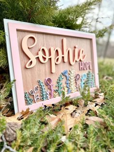 there is a sign that says sephia hope on it in front of some leaves