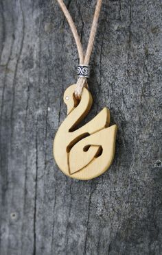 "This very unique Celtic Necklace will be made for you, or a loved one, in my studio on the West of Ireland. This beautiful Celtic Swan pendant features a piece of boxwood, recycled from musical instruments constructed by a local luthier. As a musician myself, I take enormous satisfaction in creating a necklace whose inherent wood has previously featured in a beautiful hand-made flute. Also, part of boxwood's attractiveness is its durability and ability to stand the test of time and of course th Artisan Wooden Jewelry As A Gift, Artisan Wood Jewelry Gift, Natural Carved Necklaces As Gift, Symbolic Carved Necklace For Gifts, Nature-inspired Wooden Jewelry Gift, Spiritual Wood Jewelry For Gifts, Engraved Natural Wood Necklace As Gift, Engraved Natural Wood Necklace For Gift, Traditional Wooden Necklace For Gift