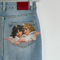 Fiorucci Angels Patch Tara Jeans Light Vintage Brand New Without Tags - No Faults Size: 25 Women’s Angels Patch Tara Jeans In A Light Vintage Wash, Featuring The Fiorucci Angels Patch On The Back Pocket. The Tara Jeans Are High-Waisted With A Tapered Leg, An Iconic 5-Pocket Design, Waistband With Belt Loop And A Button And Zip Fly. Hand-Crafted From Premium Denim Made Of Organic Cotton. Slim Fit Tapered Leg High Waist Belt Loops With Button And Zip Fly Closure 5-Pocket Style Originally $260 Fiorucci Jeans, Customized Jeans, Fiorucci Angels, 2000s Room, Angel Jeans, Danny Brown, Cool Jeans, Angels Jeans, Leather Jeans