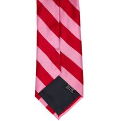 This sweetheart of a tie was made for your Valentine's Day date. The pink and red collegiate stripes are not too wide or too narrow, just right at 0.75-inches. Pair it with a black, gray or navy suit and a pink or red solid color pocket square for a formal look that's sure to impress your beloved. (Pocket squares sold separately.) As far as the specifics, this is a regular length and width men’s tie. The material is heavyweight and durable. It's not too shiny or too matte, but has just enough of Classic Pink Tie For Business, Classic Pink Business Ties, Classic Pink Business Tie, Pink Standard Tie For Black Tie Events, Classic Pink Tie For Black Tie Events, Red Solid Color, Valentines Day Date, Navy Suit, Pocket Squares