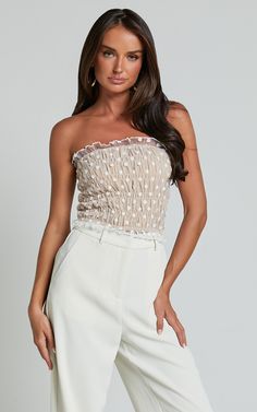 Get ready to turn heads at your next party or festival with the Harper Top - Frill Shirred Bandeau Crop Top in White/Nude! This stunning bandeau top features a delicate mesh fabric that adds a touch of elegance to any outfit. The shirred bodice provides a flattering, body-hugging fit that is both comfortable and stylish. Made from high-quality polyester, this crop top is designed to keep you looking fabulous all night long. Whether you pair it with high-waisted jeans for a casual look or dress i Bandeau Crop Top, Bandeau Top, Mesh Fabric, No Frills, High Waist Jeans, Casual Looks, Bodice, Crop Top, Mesh