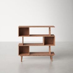 a wooden shelf sitting on top of a white floor