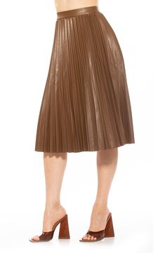 Crisp pleats define this faux-leather skirt cut to a knee length and topped with a high waist. 28" length (size 2) 100% polyurethane Spot clean Imported Model stats: 5'10" height, 32" bust, 25" waist, 36" hip. Model is wearing size 2. Vegan Leather Skirt, Leather Pleated Skirt, Leather Midi Skirt, Blazer And Skirt, Exclusive Clothing, Faux Leather Fabric, Faux Leather Skirt, Pleated Midi Skirt, Girls Night Out