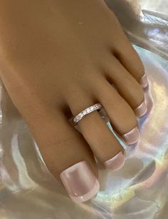 This silver toe ring features sparkling inlaid crystals. Comfortable and versatile, it can be adjusted to fit your toe size. Can be worn as beachwear, wedding footwear, for yoga or dance classes, or simply to dress up your feet. This toe ring is adjustable and is one size fits most. All items are made in a smoke free environment * If there is any issue with your footwear, please let me know so that I can correct it Thanks for visiting my shop! 👣 Nickel-free Silver Toe Rings For Wedding, Adjustable Silver Toe Rings For Wedding, Adjustable Silver Toe Rings For Anniversary, Adjustable Silver Sparkling Crystal Ring, Adjustable White Crystal Toe Ring, White Gold Toe Rings For Promise Ring, Adjustable Silver Crystal Ring With Rhinestones, Silver Nickel-free Toe Ring, Adjustable Silver Crystal Toe Ring