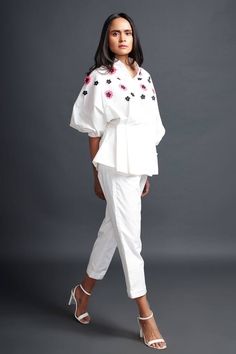 White pleated shirt with cutwork confetti applique embroidery. Paired with pant.
Components: 2
Pattern: Embroidery
Type Of Work: Confetti applique
Neckline: Mandarin collar
Sleeve Type: Puffed sleeves
Fabric: 100% Cotton
Color: White
Other Details: 
Side pockets
Occasion: Party - Aza Fashions Chic White Embroidered Set, Mandarin Collar Shirt, Pleated Shirt, Pattern Embroidery, Applique Embroidery, Cotton Embroidery, Fashion App, Puffed Sleeves, Collar Shirt