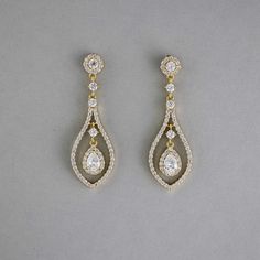 Glistening teardrop-shaped CZ earrings, crafted in layers of timeless beauty, will add a touch of subtle elegance to your bridal look. These earrings are rhodium or gold plated, hypoallergenic, lead, nickel, and cadmium free, and made with AAA CZ stones. They measure about 2 inches long and 5/8 inches wide and have post pierced backs. Teardrop Bridal Earrings, Fav Products, Teardrop Jewelry, Weaving Ideas, Gold Earrings Wedding, Eye Makeup Designs, Pinterest Ideas, Subtle Elegance, Random Ideas