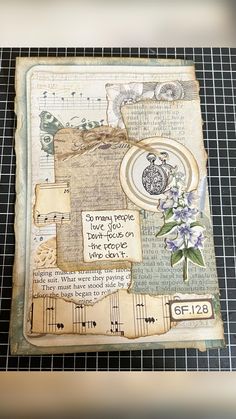 an altered album with music and flowers on it