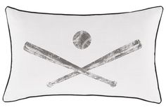 a pillow with two baseball bats and a ball in the center on a white background