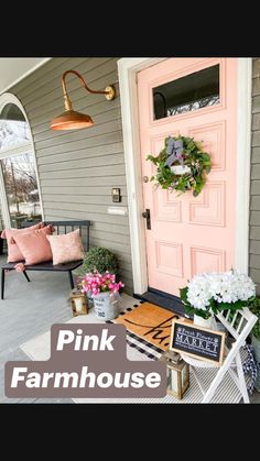 the front porch is decorated with pink and white flowers