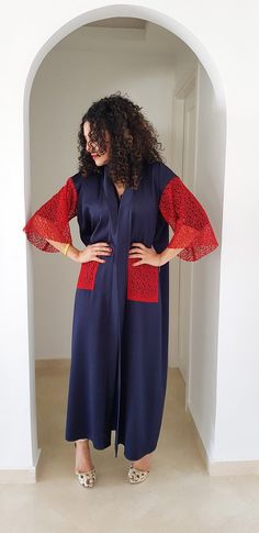 This is a very beautiful kimono ethically designed and made in Morocco.DETAILS80% viscose, 20% elastaneNavy blue with red lace arms and pocketsMaxi Length 1.40 meter /55 inchOne size fits allHandmade in MoroccoGot a question!! don't hesitate to contact me :) Long Kimono For Beach Eid Festival, Elegant Maxi Dress With Kimono Sleeves For Festival, Elegant Red Kimono For Summer, Elegant Red Summer Kimono, Red Maxi Dress With Kimono Sleeves, Red Kimono With Kimono Sleeves For Beach Cover-up, Red Kimono With Kimono Sleeves For Beach, Free Size Maxi Dress With Kimono Sleeves, Elegant Maxi Length Kimono For Festivals