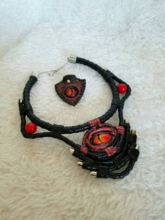 This is a unique necklace crafted from genuine leather, painted with acrylics, hand-painted dragon-eye stylized glass eye and natural stone coral, this unique necklace will protect you from ill will and will give you compliments from anyone who sees it. To see more of my products visit my page in Instagram https://www.instagram.com/mariyana.sobol Halloween Dragon, Magic Amulet, Painted Dragon, Personalised Leather Journals, Enchanted Jewelry, Leather Journal Cover, Dragon Eye, Necklace Craft, Unique Necklace