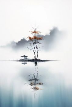 a lone tree is reflected in the still water