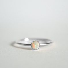 Natural Opal Ring, 925 Sterling Silver, Round Opal Gemstone Ring, Natural Gemstone, Simple Band Ring, Christmas Gift, Can Be Personalized Ring Metal :- 925 Sterling Silver (Stamp on the Product) **Gemstone Size depends on the Ring Size.** **The Product you will receive may vary from the image as no two gemstone are similar and images cannot define exact product definitions.** Shipping Policy:- I mainly use DHLE, PPS, FedEx for the shipping of goods depending on the amount and days that you have Silver Opal Birthstone Ring Gift, Silver Opal Stackable Rings As Gift, Sterling Silver Opal Ring With Bezel Setting As Gift, Sterling Silver Opal Birthstone Ring As Gift, Gift Opal Ring With Bezel Setting In Sterling Silver, Adjustable White Gold Opal Birthstone Ring, White Gold Opal Ring Gift, White Gold Round Opal Ring For Gift, Sterling Silver Opal Ring Gift