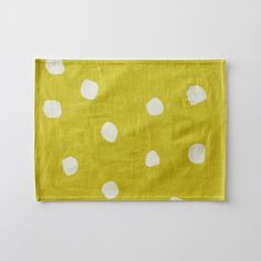 a yellow cloth with white polka dots on it