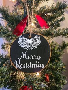 a christmas ornament hanging from the top of a tree