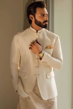 Elegant prince coat features rich quality embellishments accentuate on front and collar Complement with matching kurta pajama Designer Mens Prince Coat Suits Cambridge England UK High Quality Mens Prince Coat Prince Coat Design For Men, Elegant Groom's Nehru Jacket With Dabka Work, Elegant Designer Suits For Festivals, Elegant Stand Collar Kurta For Wedding, Elegant Wedding Kurta With Stand Collar, Elegant Traditional Wear For Groom On Diwali, Fitted Sherwani With Buttons For Wedding, Elegant Semi-formal Kurta With Dabka Work, Fitted Wedding Sherwani With Buttons