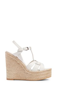 An icon since it first debuted on the runway, Saint Laurent's stylishly strappy Tribute sandal is updated by an espadrille-wrapped platform wedge. Style Name:Saint Laurent Tribute Espadrille Wedge (Women). Style Number: 5378710. Elegant Leather Espadrilles For Vacation, Designer Summer Wedge Heel Espadrilles, Designer Summer Espadrilles With Wedge Heel, Luxury Spring Wedge Sandals With Heel Strap, Designer Leather Espadrilles For Vacation, Luxury Summer Wedge Sandals With Wrapped Heel, Luxury White Wedge Sandals For Summer, Luxury Leather Espadrilles For Vacation, Luxury White Wedge Sandals For Spring