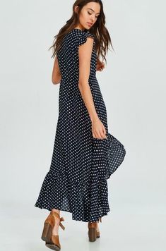 Final Sale - Get it before it's gone! STYLE INFORMATION: We're head over heels with affection for the Dotty & Me Navy Blue and White Polka Dot Maxi Dress! This woven dress is a sunny day favorite with its short, ruffle cap sleeves, and cute polka dot print. High-low bodice, with scoop neckline, tops a lightly flared maxi skirt with ruffle hem. Button loop front closure and cinched drawstring waist ensures a perfect fit. DETAILS & CARE: Rayon. Hand wash cold. Imported. SHIPPING: Orders are proces Casual Polka Dot Midi Dress For Spring, Casual Polka Dot Maxi Dress For Beach, Casual Polka Dot Midi Dress For Summer, Spring Beach Maxi Dress With Polka Dot Design, Spring Vacation Polka Dot Maxi Dress, Flowy Polka Dot Midi Dress, Flowy Polka Dot Dress For Vacation, Short Sleeve Polka Dot Maxi Dress For Beach, Polka Dot Flowy Dress For Vacation