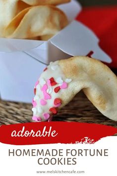 homemade fortune cookies with pink sprinkles and white frosting in a box