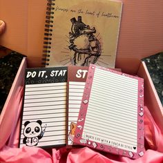 two notebooks in a pink box with writing paper on top and a notepad attached to it