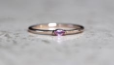 "A dainty marquise pink sapphire is at the center of our \"Wink\" ring, giving you just a little wink of sparkle! - Marquise stone measures 4mm x 2mm - Handcrafted out of 14K yellow, rose, or white gold - Round band measures 1.2mm in width Processing Times - Current processing time is 1 - 3 weeks. Each Item is handmade to order with love and care! In Stock Items - Contact Liesel Love with any rush order questions, or to see if we have anything ready made and in stock. Returns - Liesel Love does Pink Marquise Gemstone Jewelry, Pink Marquise Jewelry For Anniversary, Pink Marquise Ruby Ring Fine Jewelry, Fine Jewelry Pink Marquise Ruby Ring, Pink Marquise Ruby Ring, Pink Marquise Ring For Anniversary, Pink Marquise Promise Ring, Pink Marquise Gemstone Rings, Pink Marquise Ring For Gift