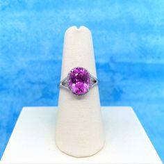 14k White Gold Oval Shape 3.52ct Created Pink Sapphire & 0.1ct White Diamond Split Shank Ring 14k Gold October Birthstones Ring 30 Day Money Back Guarantee Total Metal Weight: 1.82 Grams Diamond Weight: 0.1 Ct Stone Weight: 3.52 Ct Minimum Color: G-H Minimum Clarity: Si1-Si2 Cut: Excellent Pink Sapphire Ring Fine Jewelry, Pink Gemstones For Formal Occasions, Formal Pink Brilliant Cut Ruby Ring, Pink Gemstones For Formal Fine Jewelry, Pink Brilliant Cut Sapphire Ring Fine Jewelry, Formal Pink Diamond Ring With Gemstone, Pink Fine Jewelry Ring With Center Stone, Formal Pink Ruby Ring With Brilliant Cut, Pink Brilliant Cut Sapphire Ring In Fine Jewelry Style