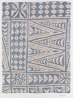 an old blue and white rug with geometric designs