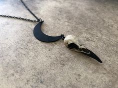 "This unique skull necklace is the perfect witchy gift for that hard to shop for friend, niece, sister or daughter. If you are looking for a one of a kind birthday gift for any lover of oddities, the occult, witchcraft, alchemy, alternative fashion or goth aesthetic... look no further! The little mini skull is hung from a black enameled crescent moon. *In stock and ready to ship from Minnesota in 1-3 days! Crescent Moon Raven Skull Lunar Necklace - Waning Moon Necklace with a 1.5\" (3.81cm) resi Spooky Black Necklace For Gift, Black Skull Necklace For Halloween, Unique Black Halloween Necklace, Halloween Moon Charm Jewelry As Gift, Unique Halloween Gift Necklaces, Unique Nickel-free Necklaces For Halloween, Unique Necklaces For Halloween Gift, Personalized Black Bohemian Jewelry, Black Moon Charm Jewelry For Halloween