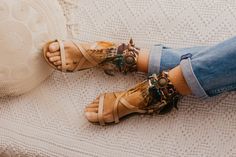 Bandana Silk anklet indie style. Made with paisley printed scarf base and feather strip in beige tones, decorated in a handmade way with suede braid and strip with old Indian coins and central applique of natural khaki hair and central dream catcher in old gold. One size: Measures approximately 24×13 cms. It is tied with suede straps at the back. Therefore it is adaptable to any ankle... Exclusive products, made in limited quantities. *SANDAL IS NOT INCLUDED Casual Toe Ring Sandals With Ankle Strap For Vacation, Trendy Spring Festival Anklets, Casual Ankle Strap Toe Ring Sandals For Vacation, Trendy Summer Festival Anklets, Casual Adjustable Open Toe Barefoot Sandals, Trendy Adjustable Ankle Wrap Sandals, Casual Toe Loop Barefoot Sandals, Casual Barefoot Sandals With Toe Loop For Spring, Casual Toe Loop Barefoot Sandals For Spring