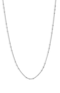 Add sophisticated shine to your layered look with this disc station necklace crafted from sterling silver. Sterling silver Imported Classic White Gold Satellite Chain Necklace, Silver Necklaces With Beaded Chain For Layering, Classic Silver Station Necklace With Delicate Chain, Silver Sterling Beaded Chain Necklace, Silver Beaded Sterling Silver Chain Necklace, Silver Layered Necklace With Delicate Chain, Silver Satellite Chain Necklace For Everyday, Silver Minimalist Satellite Chain Necklace, White Gold Sterling Silver Necklaces With Satellite Chain