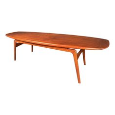 an oval wooden table with two legs and a curved top, viewed from the side