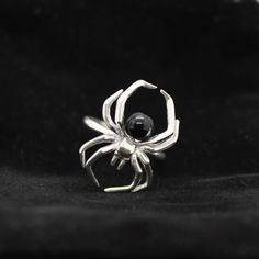 Spider Unique Ring Jewelry, Spider Round Abdomen Ring, Halloween Jewelry, Gothic Gifts, Unique Holiday Gifts, Handmade Spider Ring,Punk Ring Product Details : Gemstone - Black Onyx Band Color - Silver  Material - Silver Processing Time : 1-3 Business Days Imagine a ring imbued with beauty, myth, and a dash of mystery! That's what our Floral Rebirth Coffin Ring for women is all about. Artfully fashioned into an antique coffin shape from Stone, it comes complete with an intricately engraved rose c Spider Ring, Beauty Myth, Coffin Ring, Spider Jewelry, Jewelry Gothic, Rose Centerpieces, Gothic Gifts, Unique Holiday Gifts, Small Jewelry Box