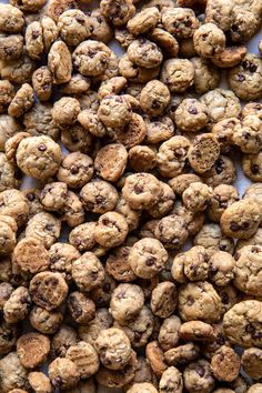 chocolate chip cookies are piled on top of each other