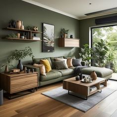 a living room filled with furniture and lots of plants on top of the shelves in front of a large window