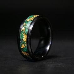 The Royal Emerald Glowstone Ring combines two luxurious colors, green and gold, to create a ring with both elegance and luster. It is housed in a durable and scratch-resistant Black Ceramic band. ■ Ring Details - Metal Type: Black Ceramic - Width: 6mm, 8mm - Inlay Materials: Emerald, Malachite, 24K Gold Leaf - Band: Comfort Fit ■ Resizing: If your ring doesn't fit perfectly, we will be more than happy to exchange it for the right size. ■ Delivery: All our rings are handmade for each order in Ame Men’s Emerald Engagement Rings, Male Engagement Ring Green, Green Fusion Rings For Formal Occasions, Modern Gold Rings With Emerald, Green Enamel Ring With Polished Finish As Gift, Black Wedding Band, Black Wedding Rings, Mens Engagement, Emerald Engagement