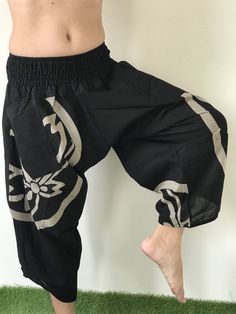 "Male Model Tall 5'9\" Waist 34\" Mens Japanese Samurai Style Japanese Casual, Harem Baggy Hakama cotton Pants Samurai Pants - elastic waistband Fits all! Unisex pants These beautiful casual pants is unique & comfortable to wear Handmade with a very lovely pattern, it is easy to wear and great for many occasions. One size fits most. These pants are great for many different activities like traveling, dancing, going to festivals, rock climbing, yoga, meditation, massage, working out, martial a Traditional Black Wide Leg Bottoms, Traditional Harem Pants For Meditation, Traditional Black Harem Pants For Yoga, Traditional Wide Leg Harem Pants For Meditation, Traditional Pants With Elastic Waistband And Relaxed Fit, Traditional Black Harem Pants With Elastic Waistband, Air Costume, Samurai Style, Martial Arts Clothing