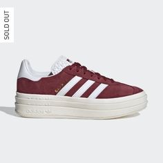 It Wouldn't Be A List Of Adidas' Most Iconic Shoes Without The Gazelle. First Worn On Indoor Courts In The '70s, The Suede Shoe Is Gaining New Fans To This Day. Now The Style You Covet Is Lifted Up To New Heights. It's Stacked Three Layers High, For A New Perspective On The Classic Style. The Details Stay Sporty With Buttery-Soft Suede And Serrated 3-Stripes. A Metallic-Gold "Gazelle" Is The Final Stamp Of Our Heritage. - Lace Closure - Suede Upper - Synthetic Lining - Rubber Outsole Brand New S Adidas Gazelle Platform Red, White Sole Sneakers With Gum Sole, Adidas Platform Sneakers With Gum Sole, Red Platform High-top Sneakers, Red Low-top Platform Sneakers With Rubber Sole, Red Low-top Platform Sneakers, Red Platform Sneakers With Red Sole, Adidas Sneakers With Gum Sole, Retro Platform Sneakers With Round Toe