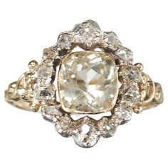 A French antique, Louis Philippe I period, cluster ring, in the Georgian style, set with a cushion cut, pale yellow, citrine, in a gold rub over setting, with an old mine-cut diamond surround, in silver, cut down, closed back settings, on a decorative gold shank, with carved shoulders, with a French eagle head mark, for 18ct gold, circa 1840. Louis Philippe, Eagle Head, Yellow Citrine, French Antique, Pale Yellow, Cluster Ring, Cushion Cut, French Antiques, Jewelry Inspiration