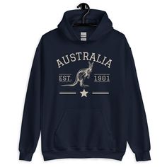 Australia Kangaroo Hoodie, Vintage Athletic Australia Jumper, Aussie Gift, Down Under Australia Pullover, Australia Sweatshirt Fleece Everyone needs a cozy go-to hoodie to curl up in, so go for one that's soft, smooth, and stylish. It's the perfect choice for cooler evenings! * 50% pre-shrunk cotton, 50% polyester * Fabric weight: 8.0 oz/yd² (271.25 g/m²) * Air-jet spun yarn with a soft feel and reduced pilling * Double-lined hood with matching drawcord * Quarter-turned body to avoid crease down Down Under, Noosa Australia, Australia Koala, Darwin Australia, Australia Kangaroo, Gold Coast Queensland, Canberra Australia, Sweat Hoodie, Queensland Australia