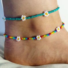 Dainty daisy anklet/ summer anklet/dainty anklet/ rainbow anklet/ rainbow anklet/ trendy jewellery/ cute boho jewellery/ dainty jewelry. Very fragile but beautiful as long as you're careful! Perfect gift for family or friends, or just something for yourself! To measure your anklet size, I suggest taking a piece of string (or a tape measure if you have one) and then measure around your ankle and choose the closest (or slightly larger) option!  If there are any problems please let me know on here or on my Instagram: @lanneaux_jewellery! Dainty Colorful Beads Anklets As A Gift, Dainty Anklets With Colorful Beads As Gift, Handmade Dainty Adjustable Anklets, Handmade Adjustable Dainty Anklets, Dainty Colorful Beaded Anklets As Gift, Handmade Trendy Anklets For Spring, Spring Anklets With Colorful Beads, Dainty Handmade Adjustable Anklets, Trendy Handmade Anklets For Spring