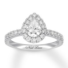 a pear shaped diamond engagement ring with the words neil lane on it's side